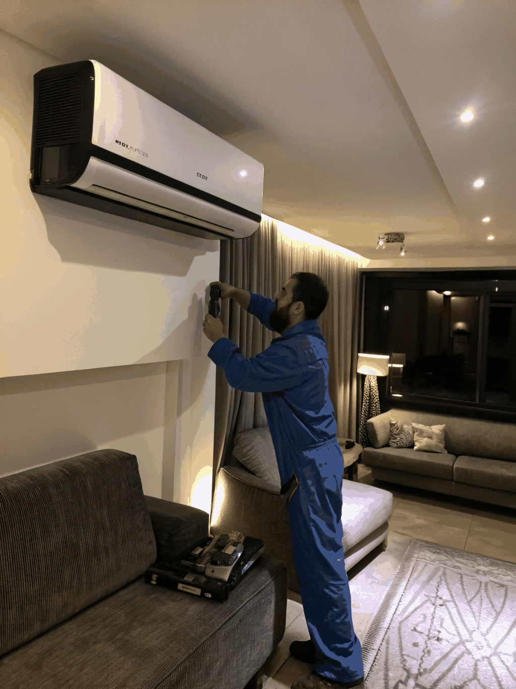 EZ Aircon technician inspecting air conditioning unit in Bukit Timah residence